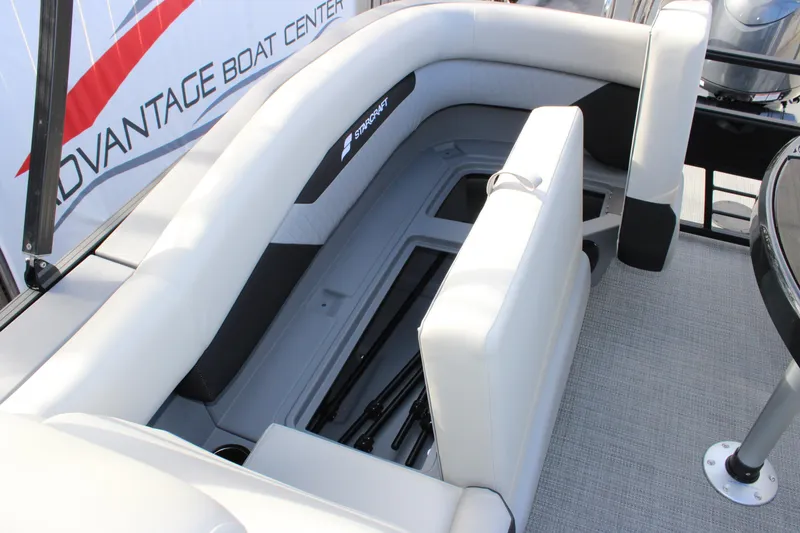 Slide: The Image of 2026 Starcraft VX 22 R DH boat interior with white seating and storage compartment. - 17