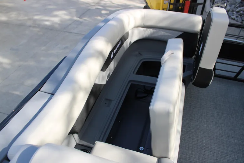 Slide: The Image of 2026 Starcraft VX 22 R DH boat interior with gray seating and storage compartment. - 20