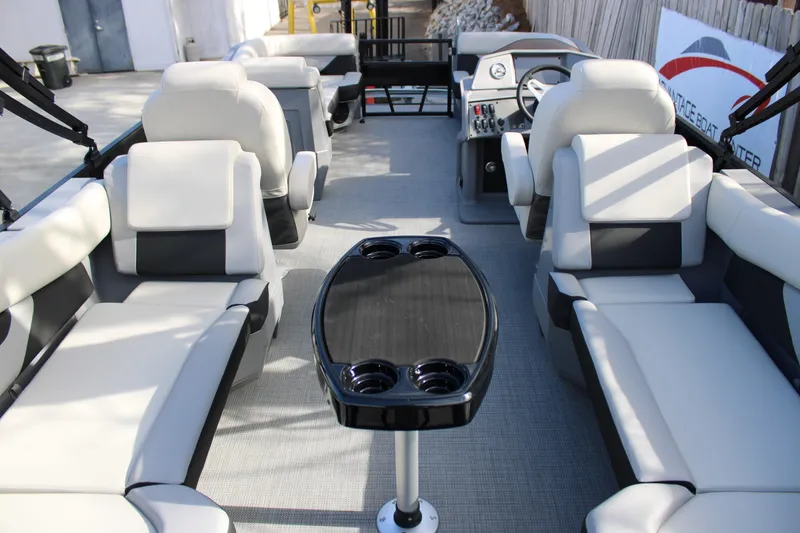 Slide: The Image of 2026 Starcraft VX 22 R DH boat interior with plush seating and central table. - 8
