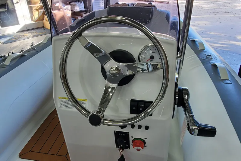 The Image of 2024 Gala A360L inflatable boat with Yamaha motor in a showroom setting. - 1