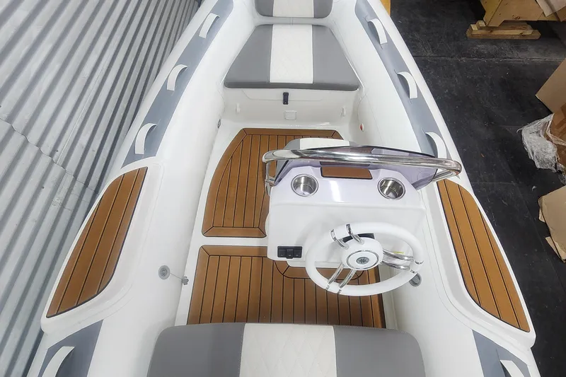 Slide: The Image of Gray and white cushioned seat on 2024 Gala A360L boat. - 4