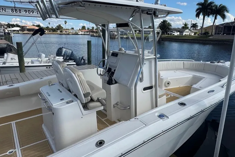 Slide: The Image of 2014 Stamas 317 Tarpon boat docked, featuring spacious deck and modern design. - 24