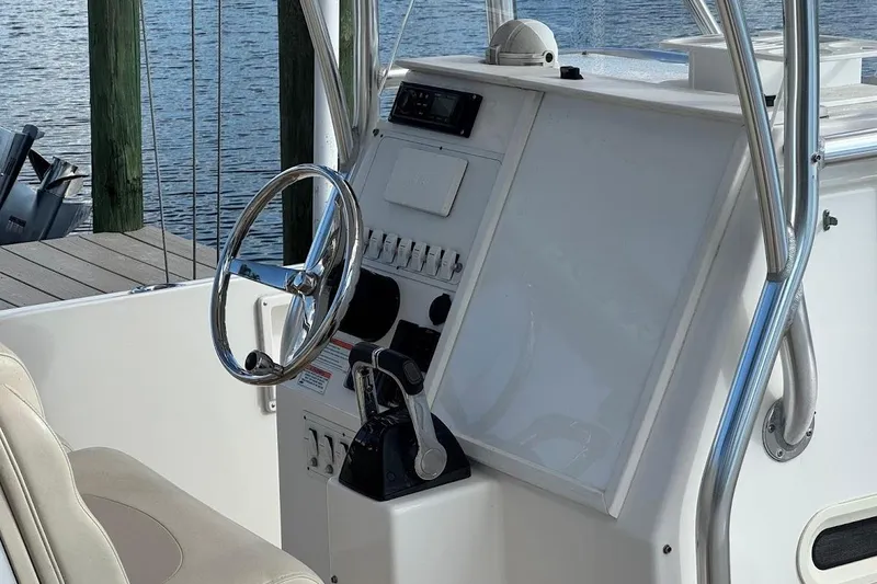 Slide: The Image of Open storage compartment on a 2014 Stamas 317 Tarpon boat, showing interior details. - 26