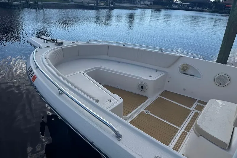 Slide: The Image of 2014 Stamas 317 Tarpon boat interior detail with storage compartment and metal fixtures. - 28