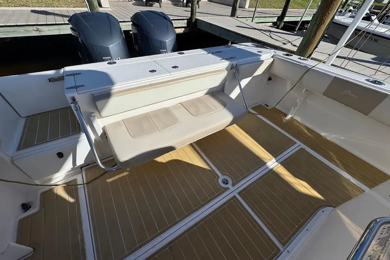 Slide: The Image of 2014 Stamas 317 Tarpon boat interior with seating and twin engines. - 41