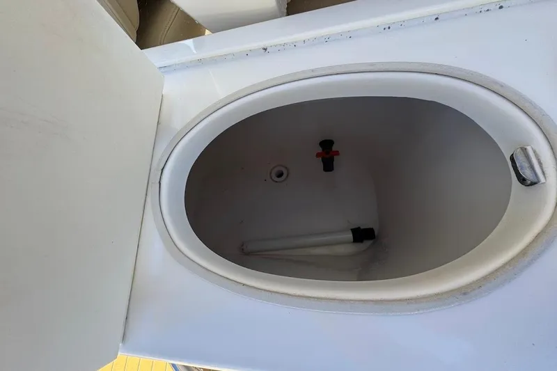 Slide: The Image of Livewell compartment on a 2014 Stamas 317 Tarpon boat, open lid view. - 47