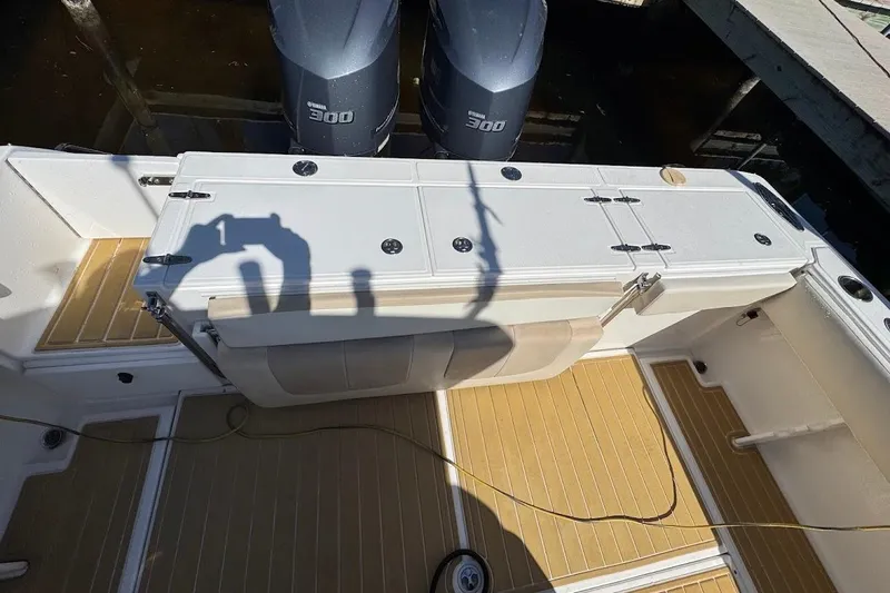 Slide: The Image of 2014 Stamas 317 Tarpon boat deck with dual Yamaha 300 engines. - 48