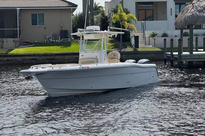 Slide: The Image of 2014 Stamas 317 Tarpon boat on water near residential dock. - 5