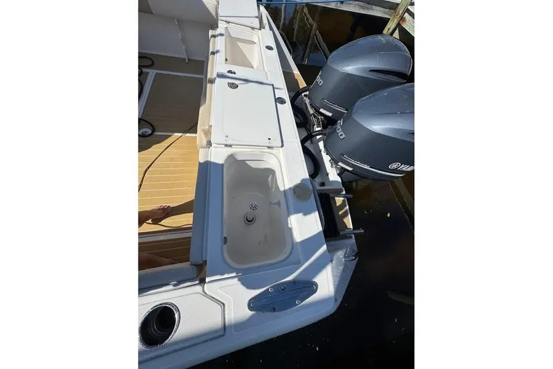 Slide: The Image of 2014 Stamas 317 Tarpon boat with dual Yamaha outboard engines, docked. - 50