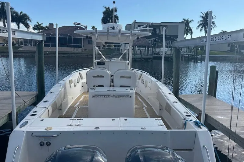 Slide: The Image of 2014 Stamas 317 Tarpon boat docked, featuring spacious deck and dual engines. - 54