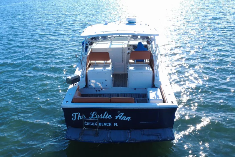 Slide: The Image of Wellcraft 330 Coastal 1996 on water under sunlight. - 10