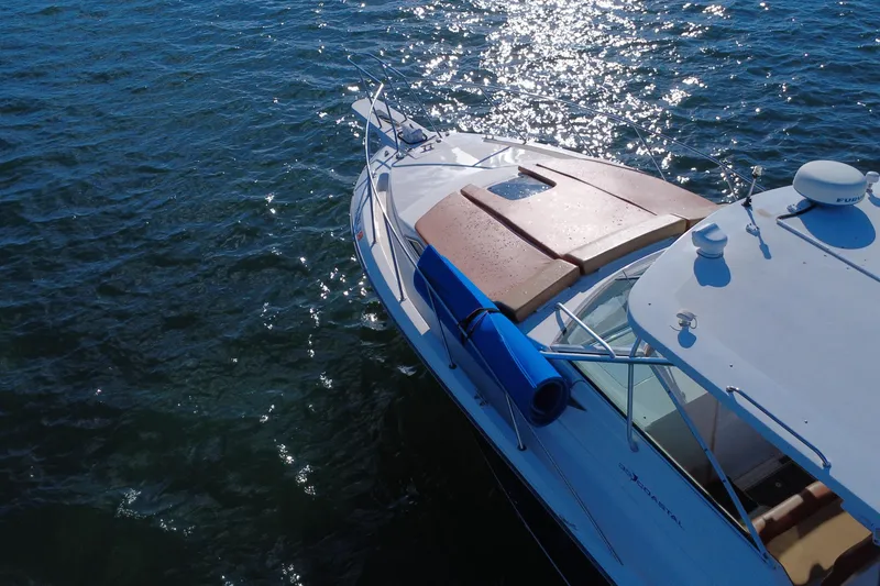 Slide: The Image of 1996 Wellcraft 330 Coastal boat on sparkling water, aerial view. - 15