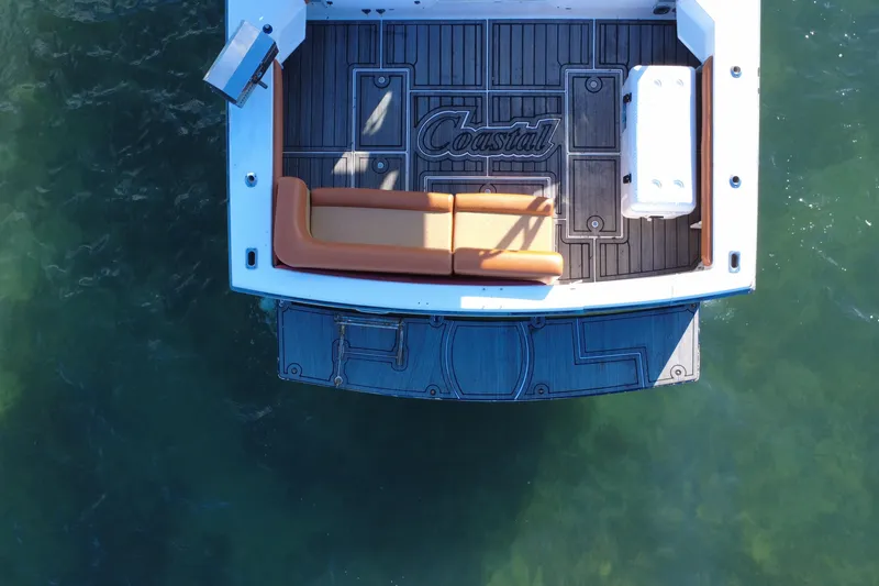 Slide: The Image of Aerial view of 1996 Wellcraft 330 Coastal boat deck on water. - 17