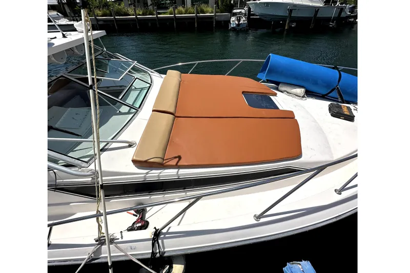 Slide: The Image of 1996 Wellcraft 330 Coastal boat on calm water. - 2