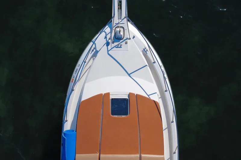 Slide: The Image of Overhead view of 1996 Wellcraft 330 Coastal boat on dark water. - 21
