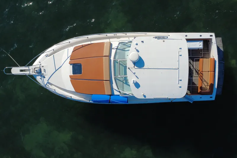 Slide: The Image of Overhead view of 1996 Wellcraft 330 Coastal boat on water. - 22