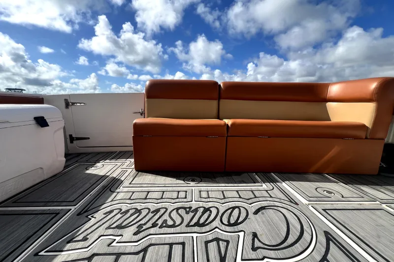 Slide: The Image of 1996 Wellcraft 330 Coastal boat on water, sunny day, city skyline in background. - 27