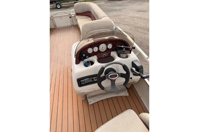Slide: The Image of 2011 Sun Tracker Party Barge 21 Signature Series interior with steering console and seating. - 8