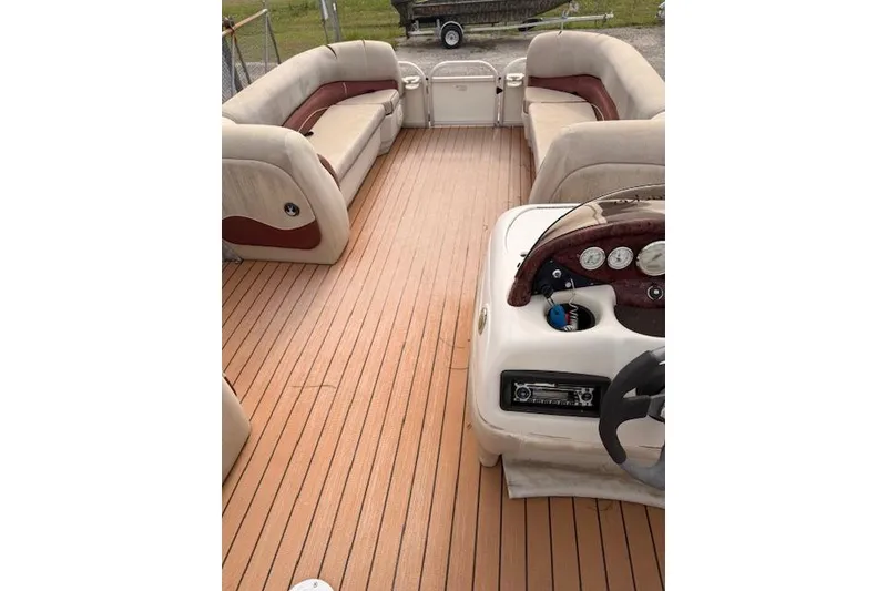 Slide: The Image of 2011 Sun Tracker Party Barge 21 Signature Series interior with spacious seating and control panel. - 9