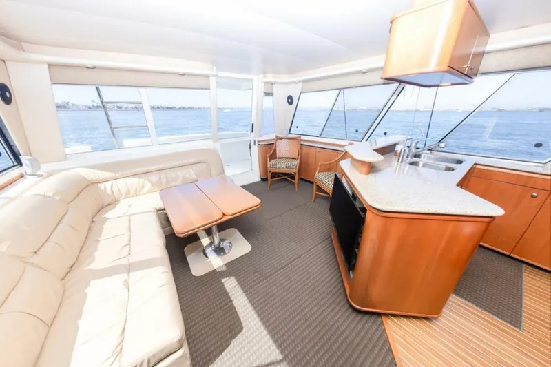 Slide: The Image of Luxurious interior of 2004 Meridian 490 Pilothouse yacht with ocean view. - 12
