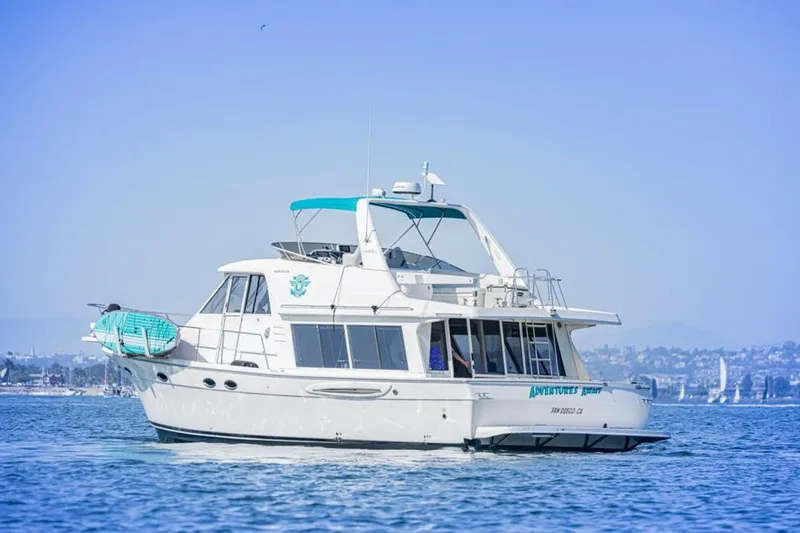 Slide: The Image of 2004 Meridian 490 Pilothouse yacht cruising on calm blue waters. - 2