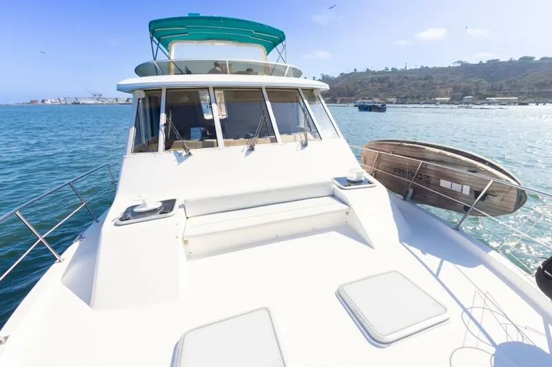 Slide: The Image of 2004 Meridian 490 Pilothouse yacht on sparkling water, top deck view. - 7