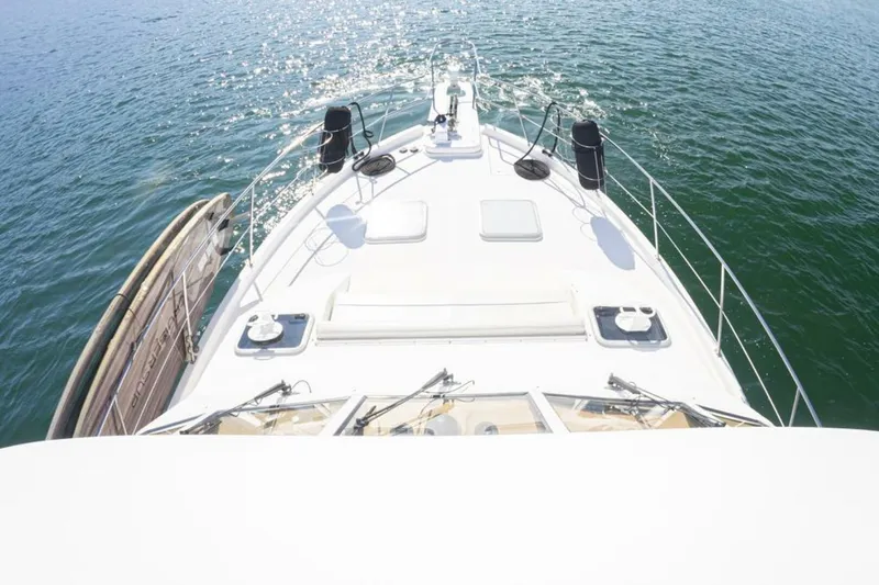 Slide: The Image of Luxurious 2004 Meridian 490 Pilothouse interior with helm, seating, and panoramic windows. - 8
