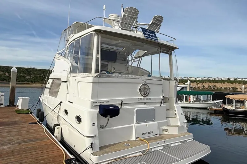 Slide: The Image of 1999 Silverton 392 Motor Yacht docked, for sale sign visible, Newport Beach, California. - 8