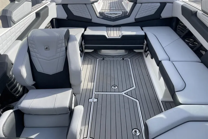 Slide: The Image of 2024 Nautique Super Air Nautique G23 interior with luxurious seating and modern design. - 12