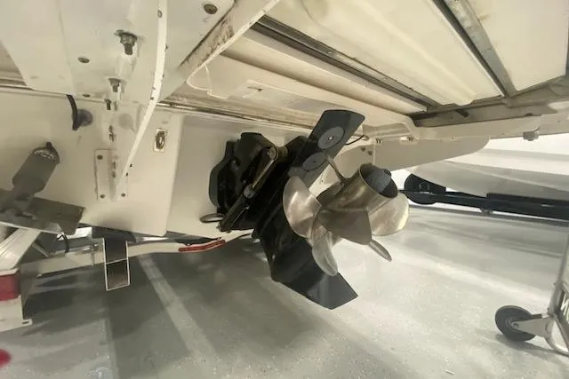 Slide: The Image of 2023 Chaparral 307 SSX boat propeller and stern view in a showroom. - 17