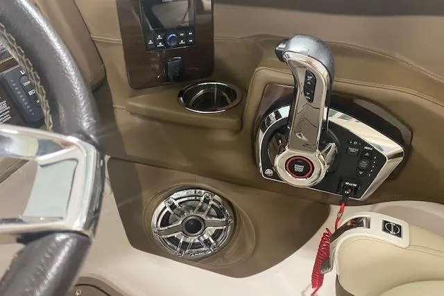 Slide: The Image of Interior of 2023 Chaparral 307 SSX boat with control panel and speaker. - 26