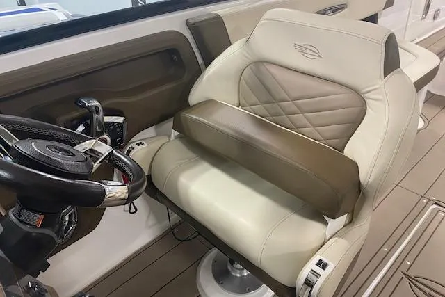 Slide: The Image of 2023 Chaparral 307 SSX boat interior with luxurious leather seating and modern steering wheel. - 27