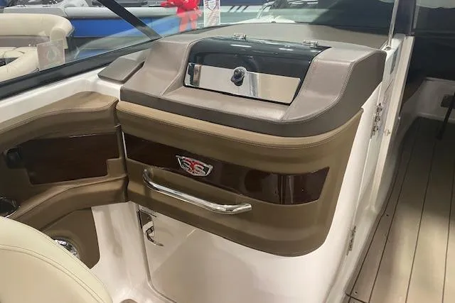 Slide: The Image of 2023 Chaparral 307 SSX boat interior with sleek dashboard and modern design. - 30