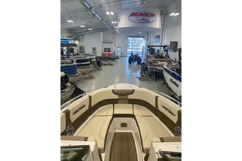 Slide: The Image of 2023 Chaparral 307 SSX boat interior in showroom, Munson Marine display. - 40