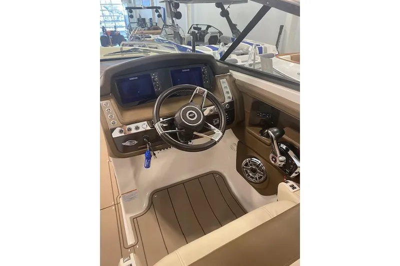 Slide: The Image of 2023 Chaparral 307 SSX boat cockpit with modern steering and control panel. - 41