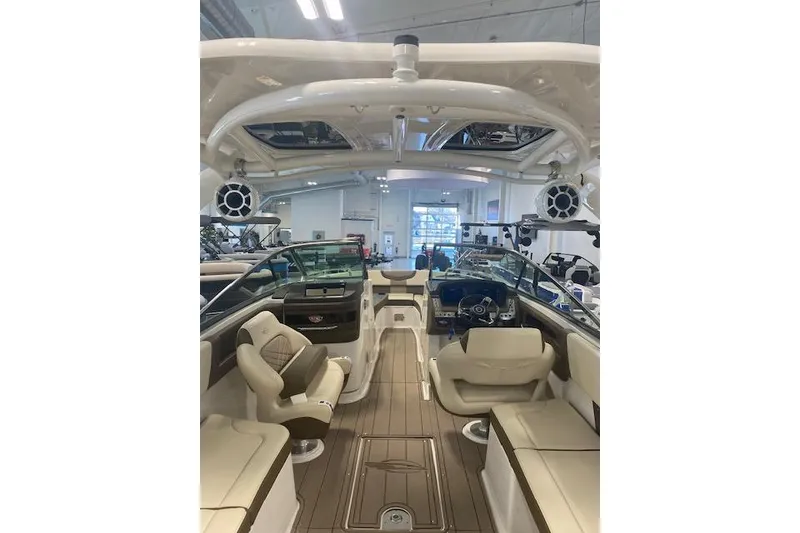 Slide: The Image of Interior view of 2023 Chaparral 307 SSX boat, featuring luxurious seating and modern design. - 43
