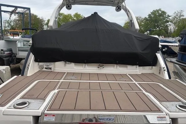 Slide: The Image of 2023 Chaparral 307 SSX boat with covered seating area and spacious deck. - 48