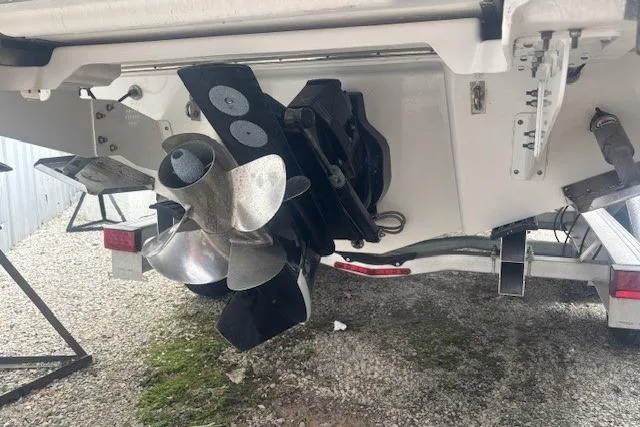 Slide: The Image of 2023 Chaparral 307 SSX boat propeller and stern drive on trailer. - 49