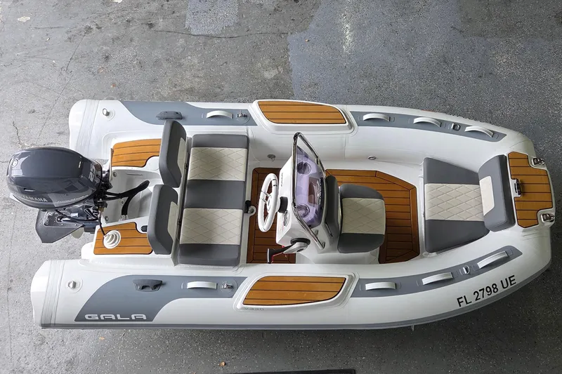 The Image of 2026 Gala Viking V330 boat with Tohatsu 30HP engine, featuring sleek design and comfortable seating. - 0