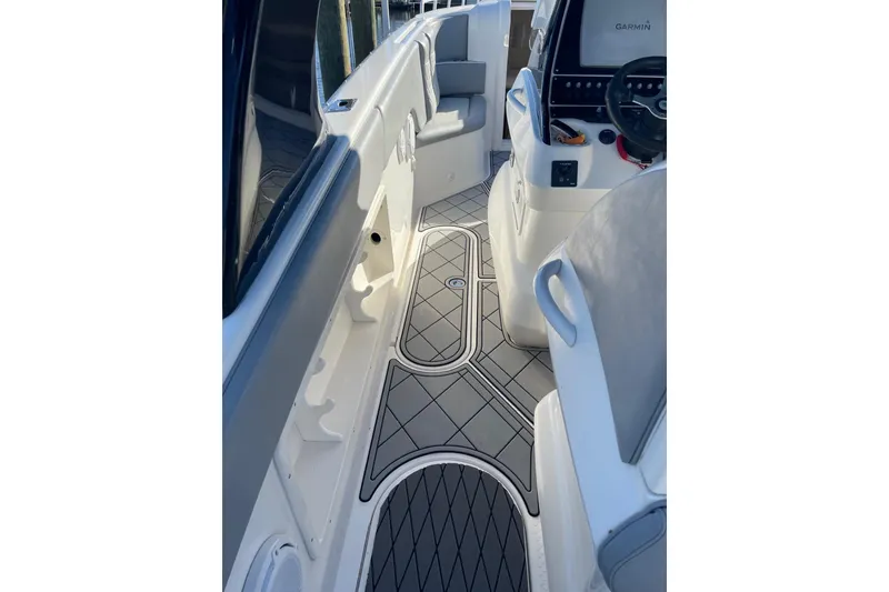 Slide: The Image of 2010 Concept 4400 Sport Yacht on calm water, featuring triple outboard engines. - 10