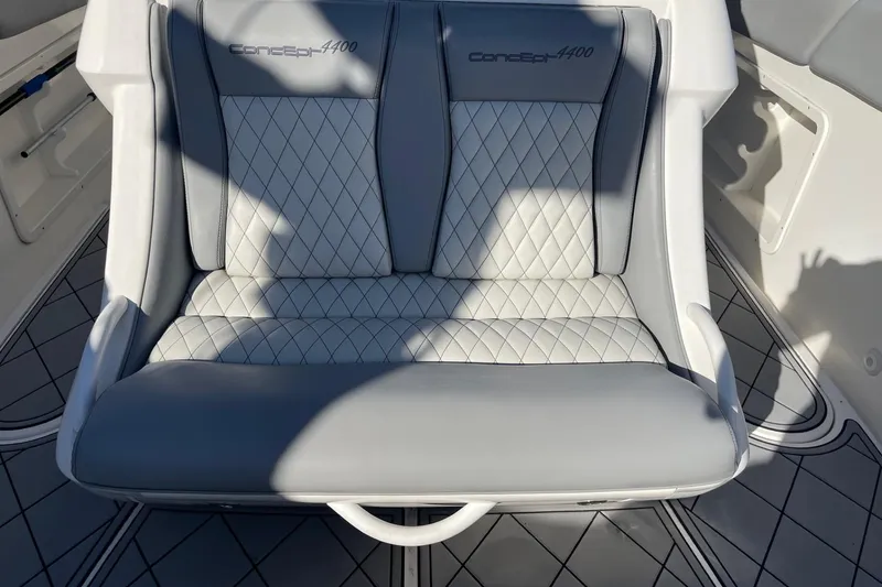 Slide: The Image of 2010 Concept 4400 Sport Yacht on calm water near waterfront homes. - 14