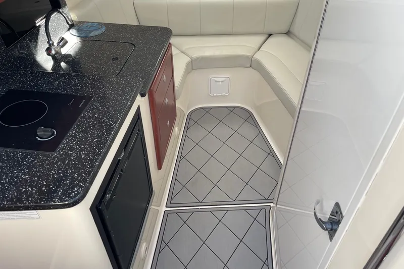 Slide: The Image of 2010 Concept 4400 Sport Yacht cruising on calm waters under a clear blue sky. - 15