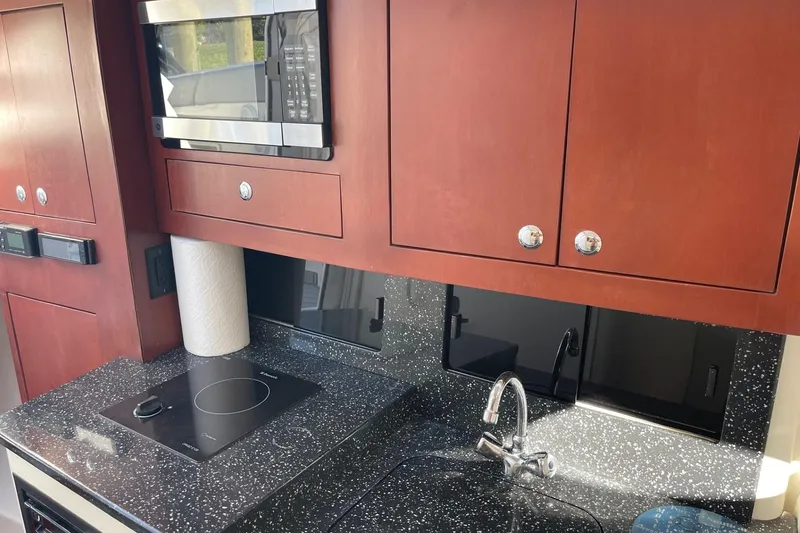 Slide: The Image of Bow view of 2010 Concept 4400 Sport Yacht in a serene canal setting. - 17