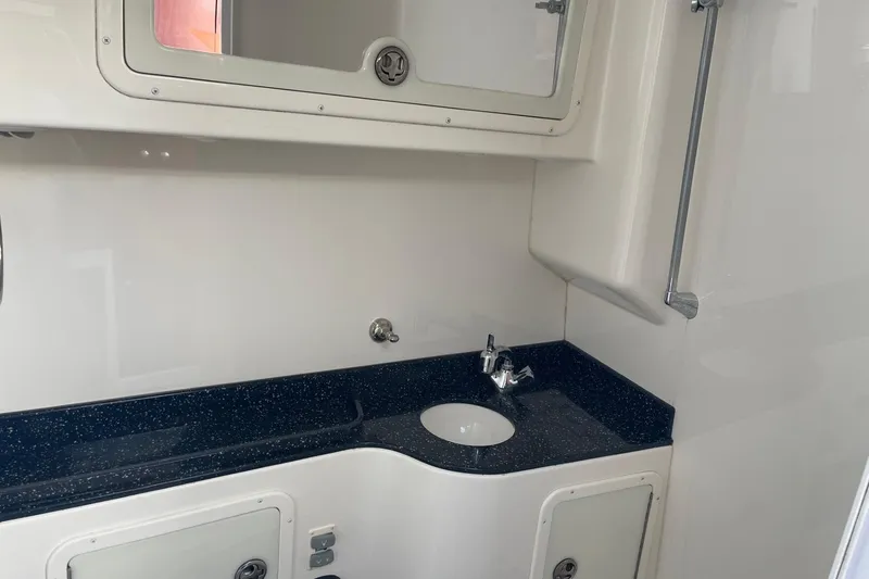 Slide: The Image of 2010 Concept 4400 Sport Yacht docked, showcasing sleek design and spacious deck. - 20