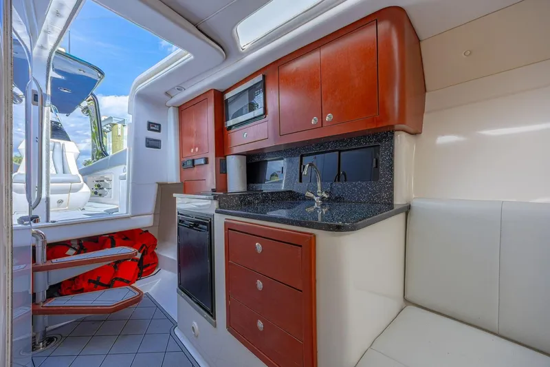 Slide: The Image of Interior of 2010 Concept 4400 Sport Yacht with modern kitchen and seating area. - 24