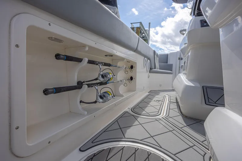 Slide: The Image of 2010 Concept 4400 Sport Yacht interior with fishing rod storage and cushioned seating. - 38