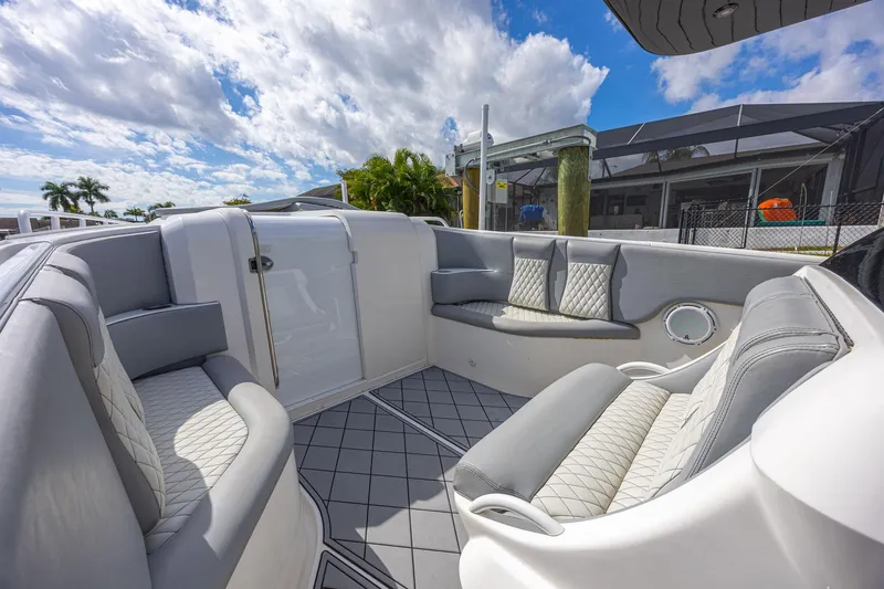 Slide: The Image of Luxurious seating area on 2010 Concept 4400 Sport Yacht under a partly cloudy sky. - 39