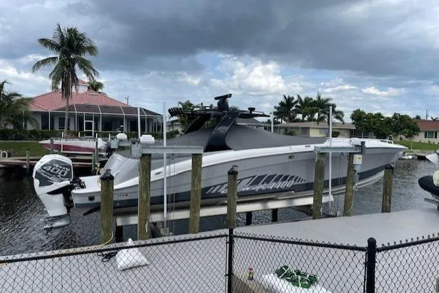 Slide: The Image of 2010 Concept 4400 Sport Yacht cruising on calm blue waters. - 4