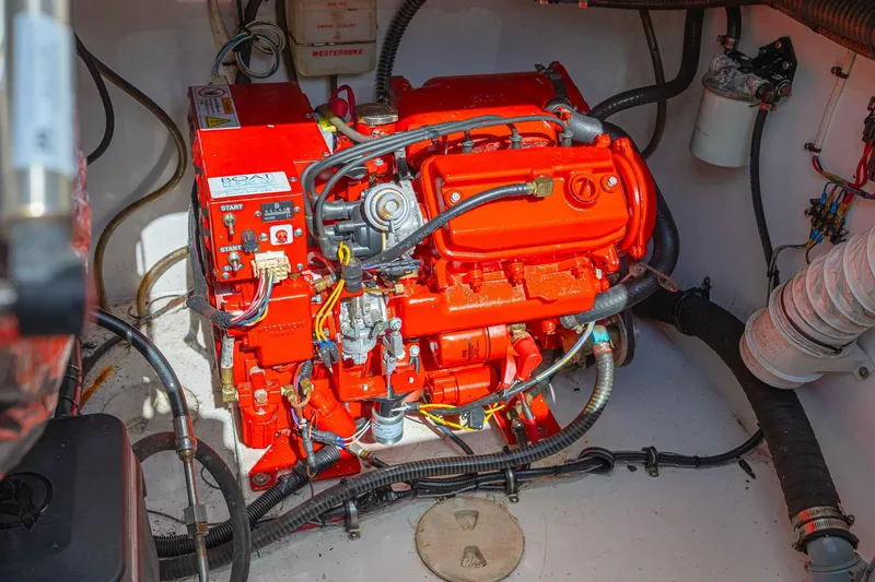 Slide: The Image of Engine compartment of 2010 Concept 4400 Sport Yacht, featuring a vibrant red engine. - 46