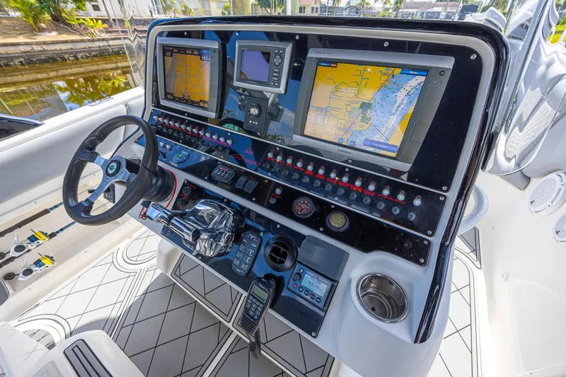 Slide: The Image of Helm of 2010 Concept 4400 Sport Yacht with navigation screens and controls. - 53